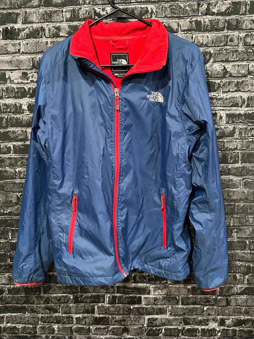 The North Face Blue Shell with Red Trim fleece lined Jacket